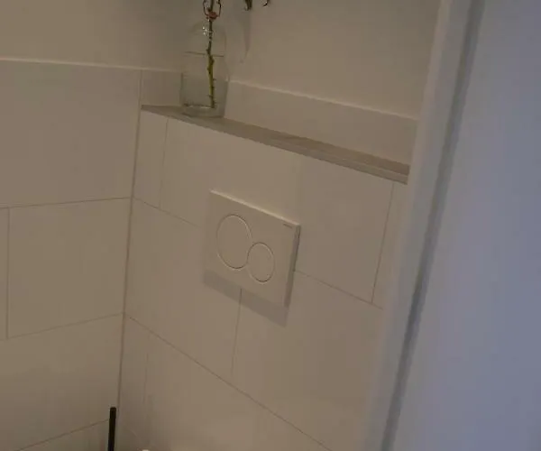 Behind The Casa de hóspedes